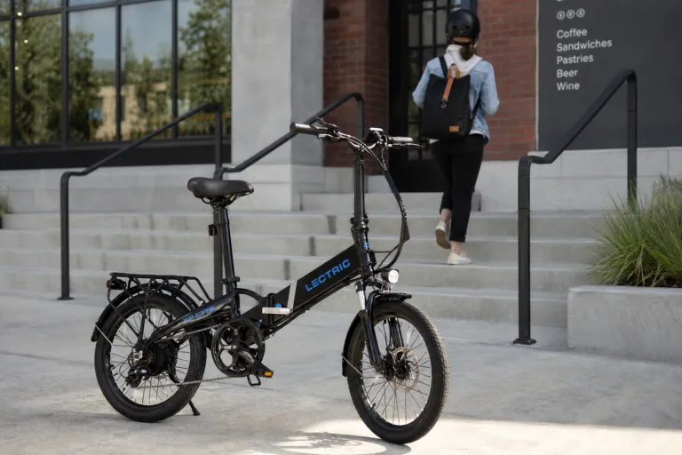 Folding e-bike parked on a city sidewalk